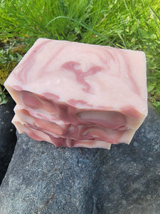 Light pink soap with darker pink swirls.
