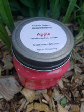 Apple Soy candle that is red in color in an 8 oz Mason jar with a pewter lid.