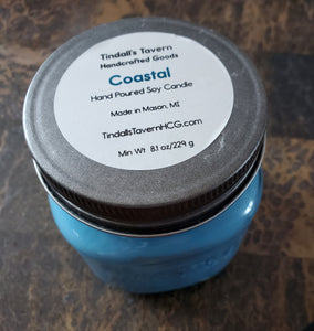 Coastal Soy candle that is blue in color in an 8 oz Mason Jar with a pewter lid.
