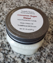 Cinnamon Sugar Donut Soy candle that is white in color in an 8 oz Mason jar with a pewter lid.
