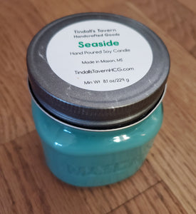 Seaside Soy candle that is greenish in color in an 8 oz Mason jar with a pewter lid.
