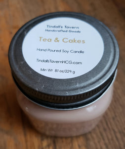 Tea & Cakes Soy candle that is tan in color inan 8 oz Mason jar with a pewter lid.