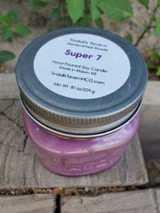 Super 7 Soy candle that is purple in color in an 8 oz Mason jar with a pewter lid.