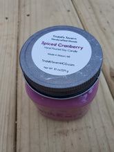 Spiced Cranberry Soy candle that is dark pinkish in color in an 8 oz Mason jar with a pewter lid.