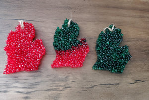 Red mitten, green and red mitten and all green mitten hanging air fresheners.