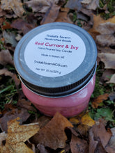 Red Currant & Ivy Soy candle that is red in color in an 8 oz Mason jar with a pewter lid.