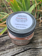 Good Morning Soy candle that is brown in color in an 8 oz Mason jar with a pewter lid.